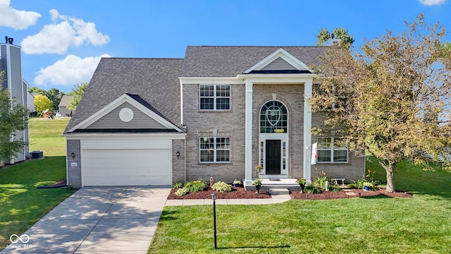 441 Viburnum Run, Westfield, IN 46074 - greek revival house featuring brick siding, concrete driveway, an attached garage, and a front yard