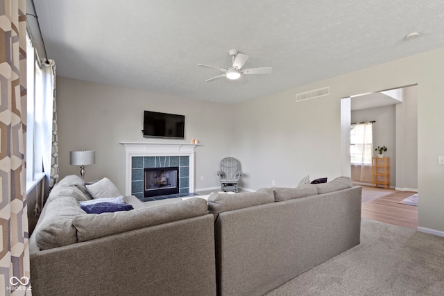 441 Viburnum Run, Westfield, IN 46074 - carpeted living room with a fireplace and a ceiling fan