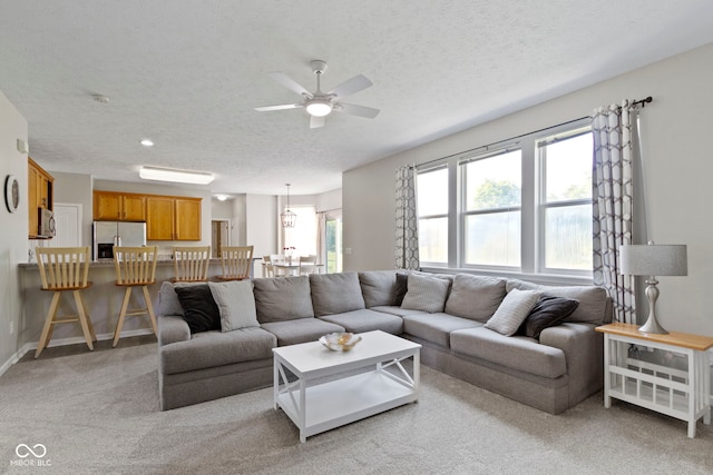 441 Viburnum Run, Westfield, IN 46074 - living room with a textured ceiling, ceiling fan, and light colored carpet