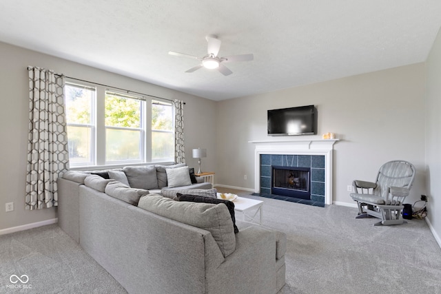 441 Viburnum Run, Westfield, IN 46074 - living area featuring ceiling fan, a tiled fireplace, and carpet floors