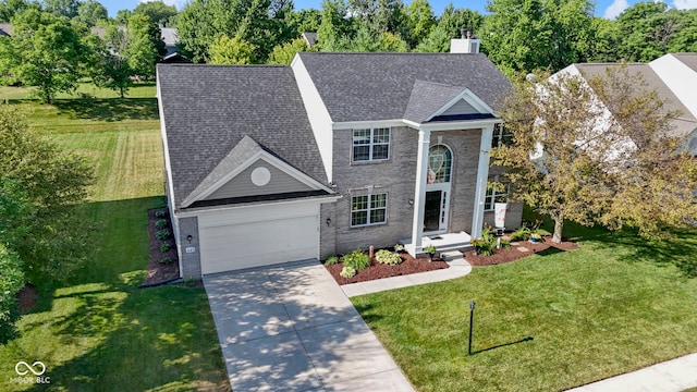 441 Viburnum Run, Westfield, IN 46074 - view of front of property with driveway, a chimney, brick siding, a garage, and a shingled roof