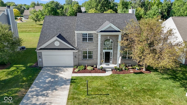 441 Viburnum Run, Westfield, IN 46074 - greek revival inspired property featuring driveway, brick siding, a garage, a chimney, and a front lawn