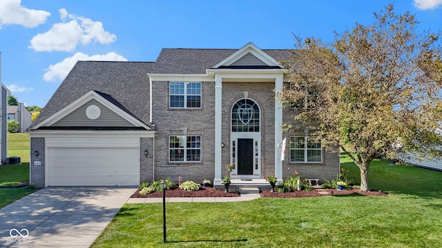 441 Viburnum Run, Westfield, IN 46074 - greek revival inspired property featuring brick siding, driveway, a front lawn, and a garage