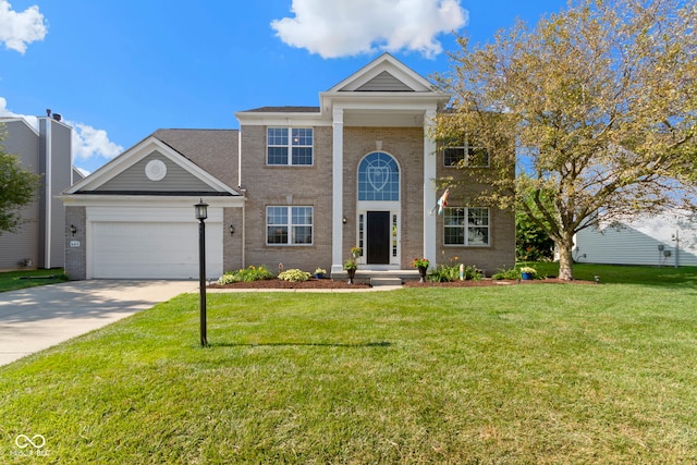 441 Viburnum Run, Westfield, IN 46074 - greek revival house featuring brick siding, concrete driveway, an attached garage, and a front lawn