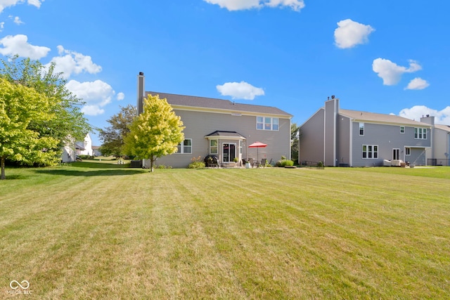 441 Viburnum Run, Westfield, IN 46074 - rear view of house with a chimney and a yard