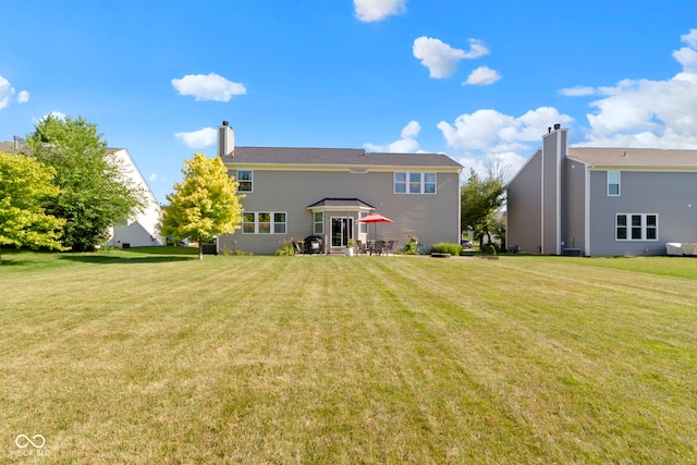 441 Viburnum Run, Westfield, IN 46074 - rear view of property with a lawn and a chimney