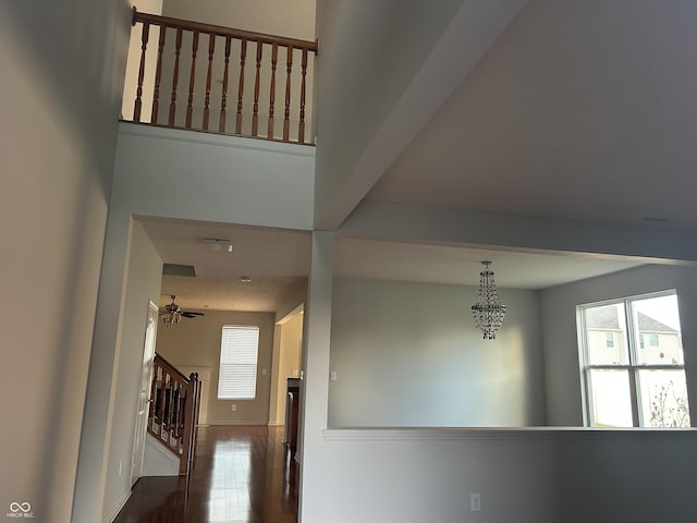 7854 Newhall Way, Indianapolis, IN 46239 - corridor with stairs and dark wood-type flooring