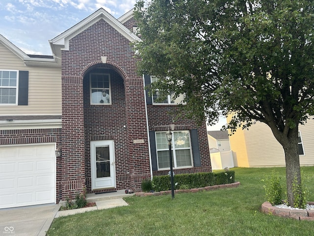 7854 Newhall Way, Indianapolis, IN 46239 - traditional-style home featuring brick siding, a garage, and a front lawn