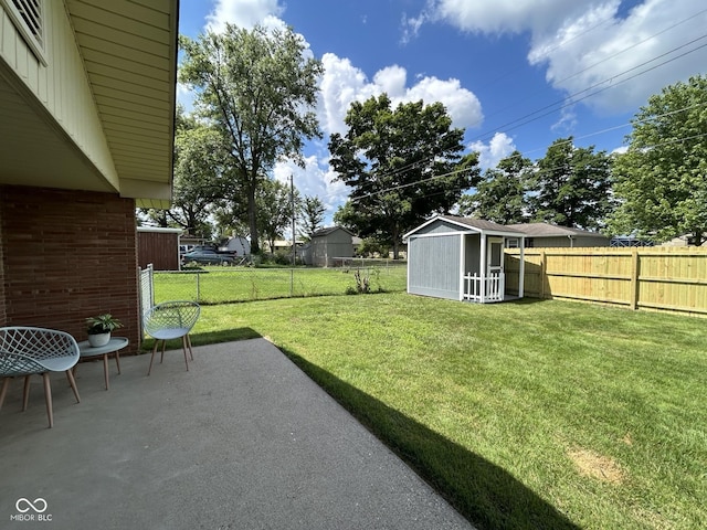 2692 Meadowlark Ln, Columbus, IN 47201 - fenced backyard with a patio area and a shed