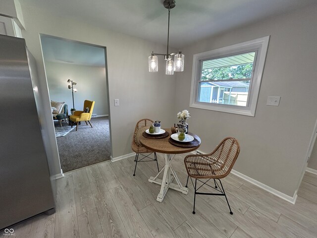 2692 Meadowlark Ln, Columbus, IN 47201 - dining room with light wood-type flooring and baseboards