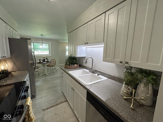 2692 Meadowlark Ln, Columbus, IN 47201 - kitchen with stainless steel appliances and white cabinets