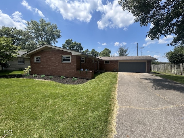 2692 Meadowlark Ln, Columbus, IN 47201 - ranch-style house featuring driveway, an attached garage, and brick siding