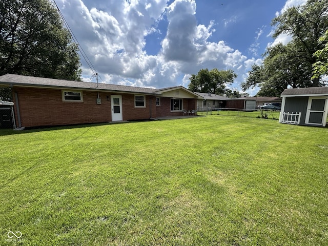 2692 Meadowlark Ln, Columbus, IN 47201 - back of property with brick siding and an outdoor structure