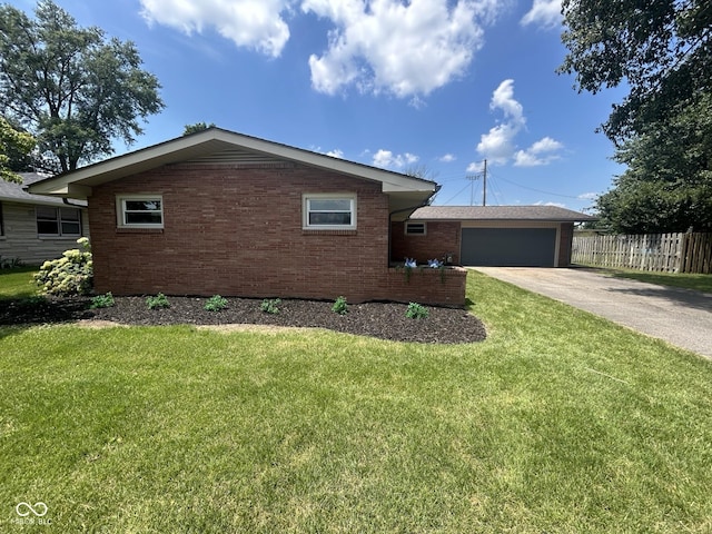 2692 Meadowlark Ln, Columbus, IN 47201 - view of front facade featuring brick siding, concrete driveway, and an attached garage