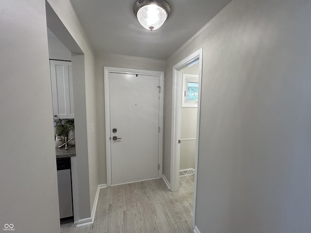2692 Meadowlark Ln, Columbus, IN 47201 - doorway featuring light wood finished floors and baseboards