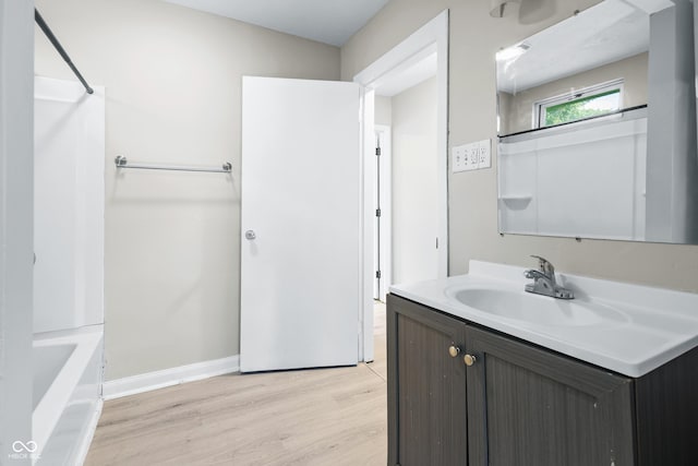 3945 N Ridgeview Dr, Indianapolis, IN 46226 - bathroom with vanity, wood finished floors, and shower / bath combination