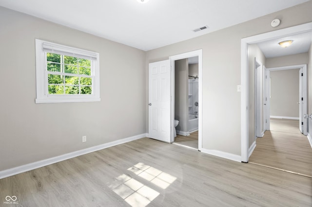 3945 N Ridgeview Dr, Indianapolis, IN 46226 - unfurnished bedroom featuring baseboards and light wood-type flooring