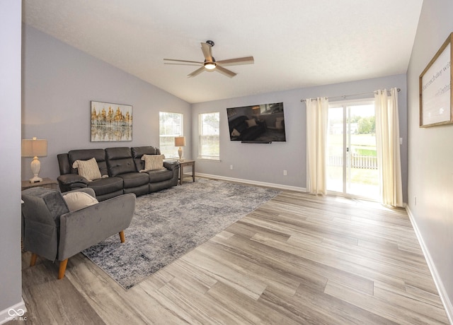 17019 Flinchum Way E, Noblesville, IN 46062 - living room featuring plenty of natural light, a ceiling fan, light wood-style flooring, and vaulted ceiling