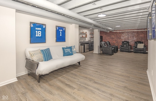 17019 Flinchum Way E, Noblesville, IN 46062 - living room featuring wood finished floors and brick wall