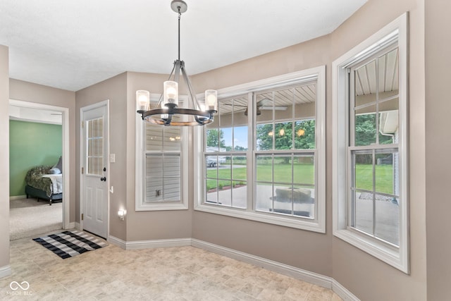 606 S Grange Hall Rd, Hanover, IN 47243 - unfurnished dining area featuring a chandelier and baseboards
