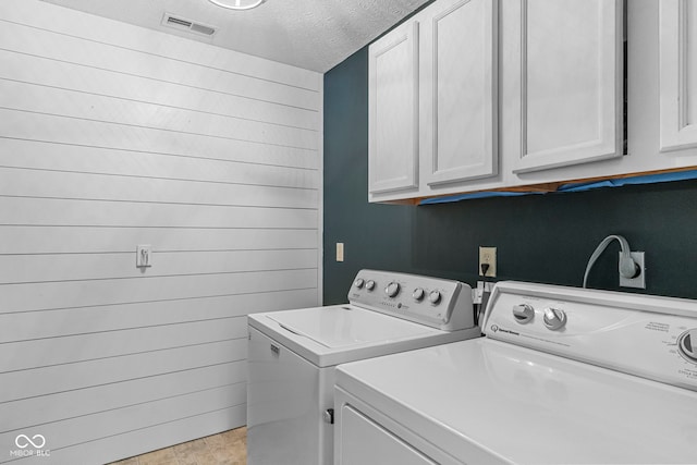 606 S Grange Hall Rd, Hanover, IN 47243 - laundry room with washing machine and dryer, cabinet space, and a textured ceiling