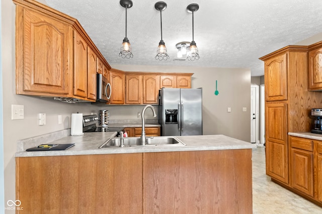 606 S Grange Hall Rd, Hanover, IN 47243 - kitchen featuring a peninsula, stainless steel appliances, pendant lighting, brown cabinetry, and a textured ceiling