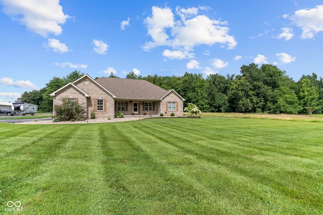 606 S Grange Hall Rd, Hanover, IN 47243 - view of front of property with a front lawn, brick siding, and roof with shingles