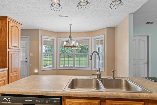 606 S Grange Hall Rd, Hanover, IN 47243 - kitchen with light countertops, dishwashing machine, a chandelier, pendant lighting, and a textured ceiling