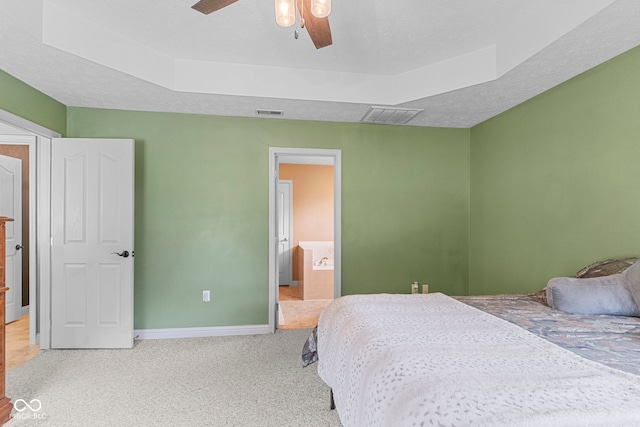 606 S Grange Hall Rd, Hanover, IN 47243 - carpeted bedroom featuring a raised ceiling, a ceiling fan, and ensuite bath