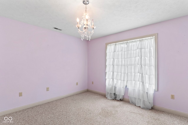 606 S Grange Hall Rd, Hanover, IN 47243 - unfurnished room featuring carpet flooring and a chandelier