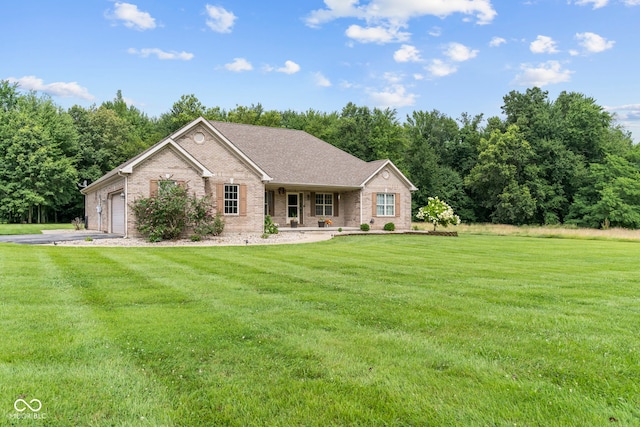 606 S Grange Hall Rd, Hanover, IN 47243 - ranch-style house with brick siding, a front lawn, an attached garage, and driveway