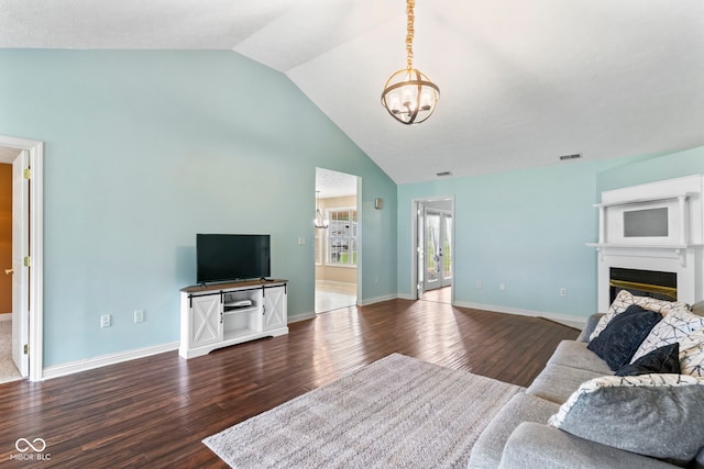 606 S Grange Hall Rd, Hanover, IN 47243 - living area with a chandelier, wood finished floors, high vaulted ceiling, and a glass covered fireplace