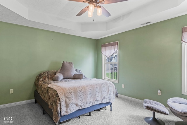 606 S Grange Hall Rd, Hanover, IN 47243 - bedroom with carpet flooring, a raised ceiling, and a ceiling fan