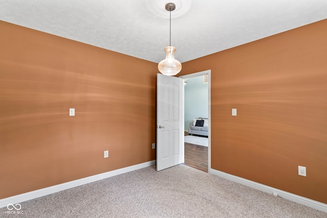 606 S Grange Hall Rd, Hanover, IN 47243 - empty room featuring carpet and baseboards