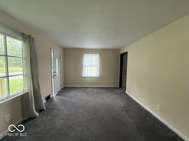 1048 S Burlington Dr, Muncie, IN 47302 - unfurnished room with baseboards and dark colored carpet
