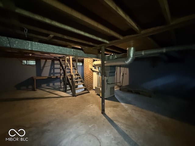 1048 S Burlington Dr, Muncie, IN 47302 - unfinished basement with stairs and heating unit