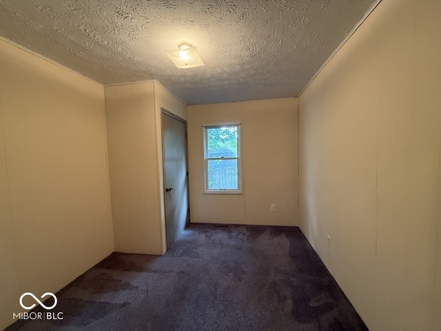 1048 S Burlington Dr, Muncie, IN 47302 - unfurnished room featuring carpet flooring and a textured ceiling