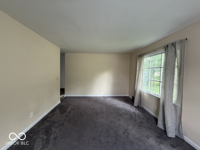1048 S Burlington Dr, Muncie, IN 47302 - carpeted spare room with baseboards