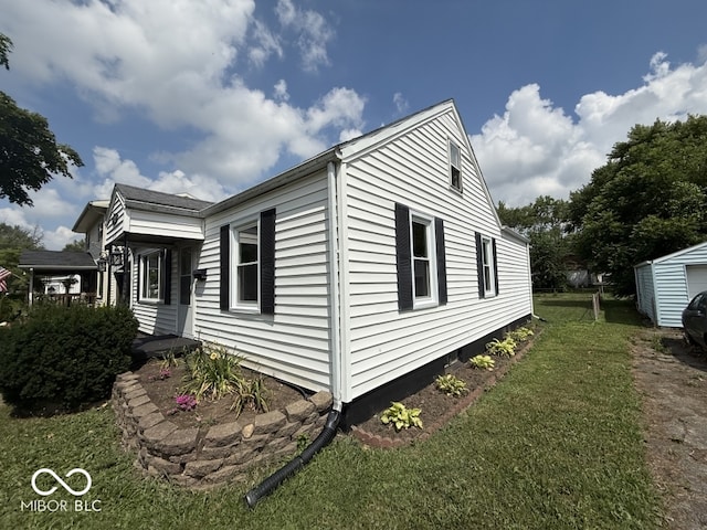 1914 E 23rd St, Muncie, IN 47302 - view of side of home featuring a lawn