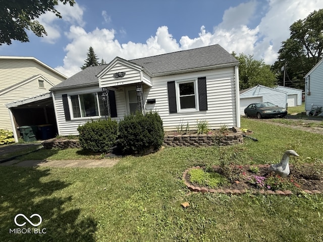 1914 E 23rd St, Muncie, IN 47302 - bungalow with roof with shingles and a front lawn