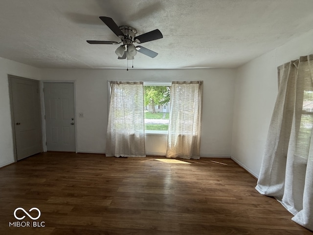 1914 E 23rd St, Muncie, IN 47302 - empty room featuring wood finished floors, ceiling fan, and a textured ceiling