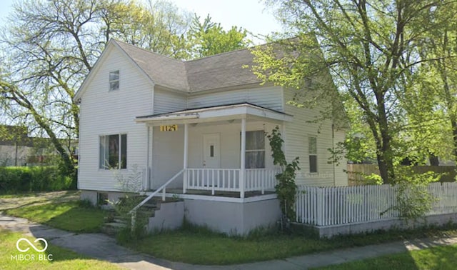 1129 Lafayette St, Elkhart, IN 46516 - view of front of property with covered porch and roof with shingles