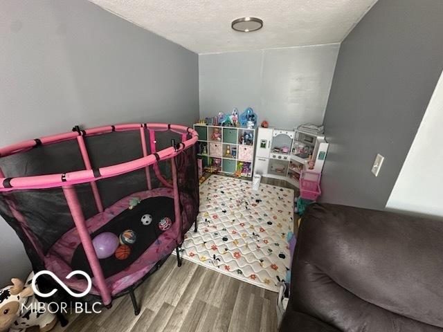 1129 Lafayette St, Elkhart, IN 46516 - bedroom featuring wood finished floors and a textured ceiling