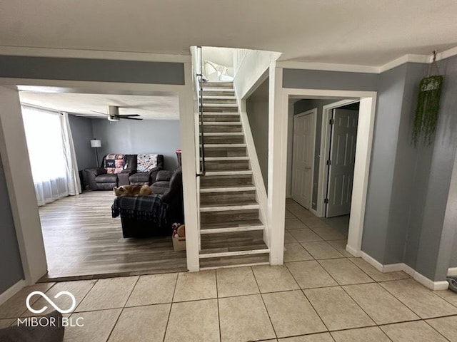 1129 Lafayette St, Elkhart, IN 46516 - stairs featuring tile patterned flooring and ceiling fan