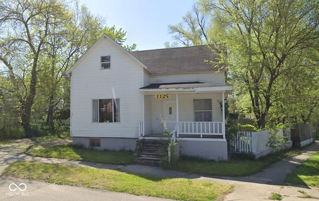 1129 Lafayette St, Elkhart, IN 46516 - view of front of property featuring covered porch and roof with shingles