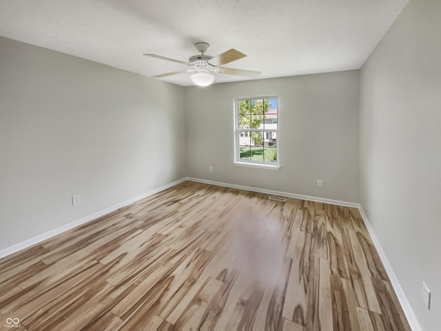 12089 Red Hawk Dr, Fishers, IN 46037 - unfurnished room featuring light wood finished floors and ceiling fan