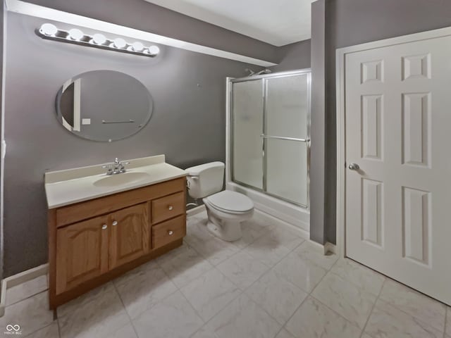 12089 Red Hawk Dr, Fishers, IN 46037 - bathroom featuring vanity, bath / shower combo with glass door, and marble look tile flooring