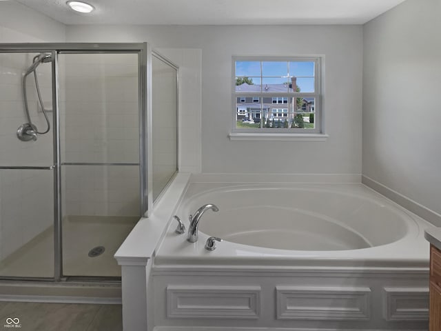12089 Red Hawk Dr, Fishers, IN 46037 - bathroom with a bath and a stall shower