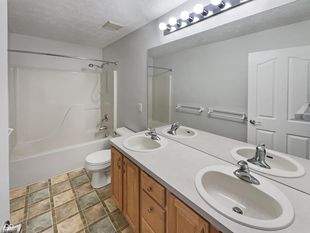 12089 Red Hawk Dr, Fishers, IN 46037 - bathroom featuring shower / bathtub combination, a textured ceiling, and double vanity