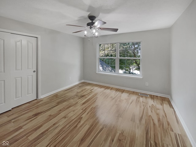 12089 Red Hawk Dr, Fishers, IN 46037 - unfurnished bedroom with wood finished floors and ceiling fan